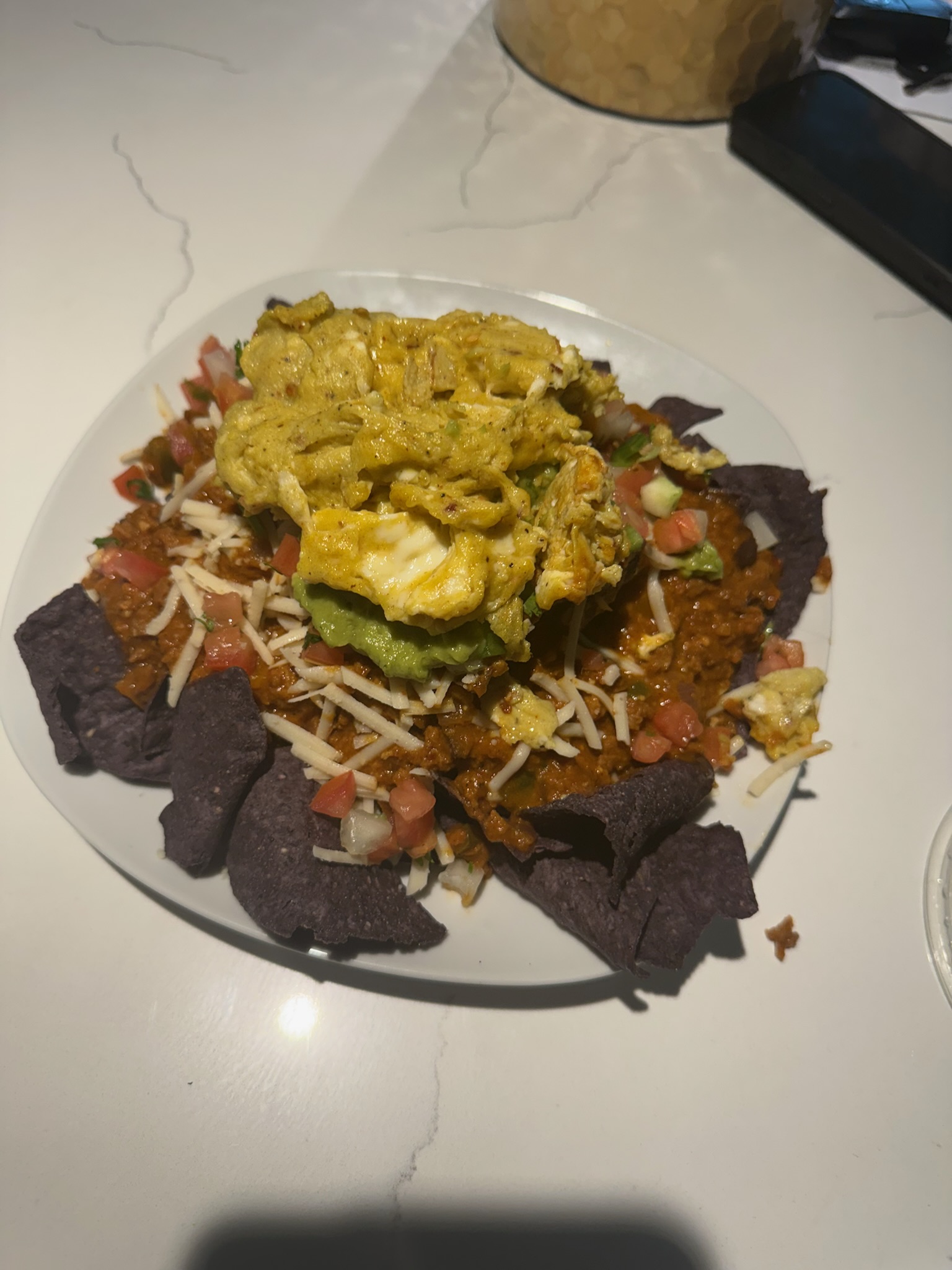 Loaded nachos plated for the kitchen side of the show